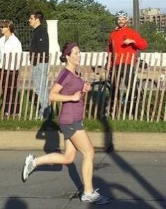 Suzy's husband cheers her on in the Twin Cities Marathon.