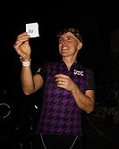 Lee, the winner of Babes in Bikeland 5, chooses the raffle winner from the champ podium. Photo by Bjorn Christianson via Flickr CC, click for original.