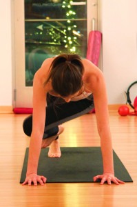 Demonstrating the perfect "mountain climber" twists! She makes it look so easy...